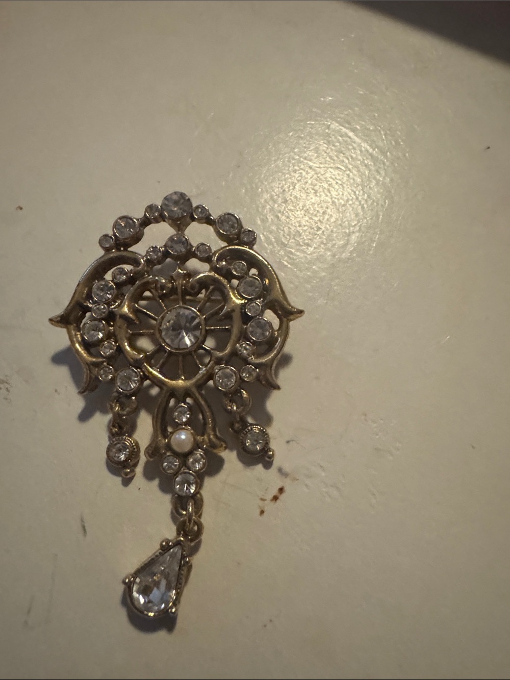 Antique-Style Gold Tone Filigree Brooch with Clear Crystals